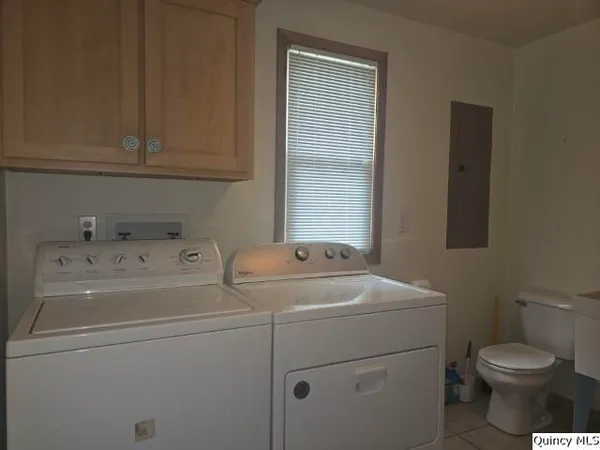 a room with water heater and painted walls