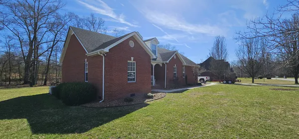 a view of a back yard of the house