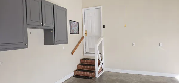 a view of entryway with wooden floor