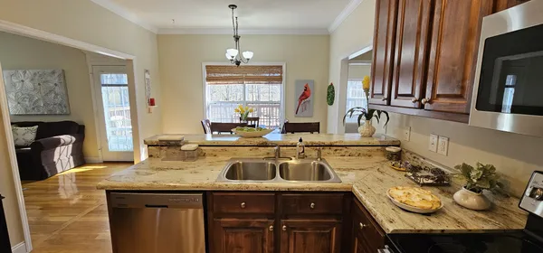 a kitchen with a sink and a refrigerator