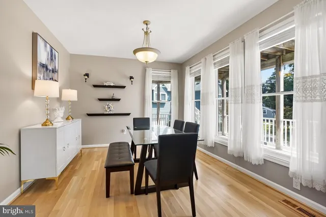 a kitchen with cabinets stainless steel appliances and sink