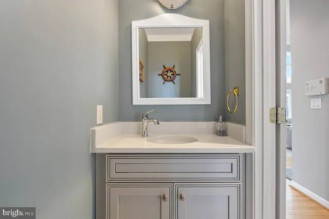 a view of a balcony with chairs and wooden fence