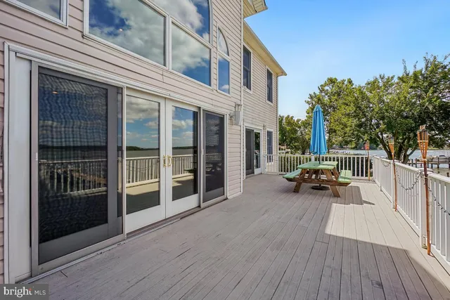 a spacious bedroom with a large bed and a large window