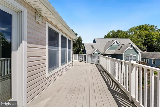 a front view of a house with a ocean view