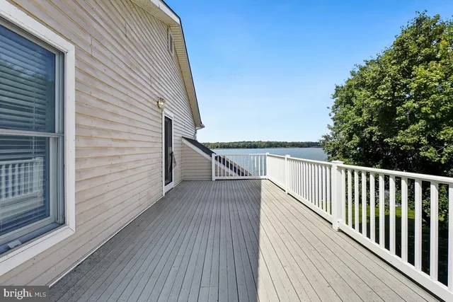 an aerial view of a house with a lake view