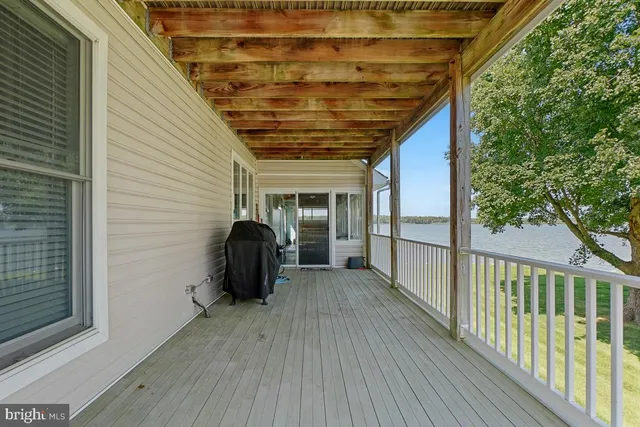 an aerial view of residential houses with outdoor space and swimming pool