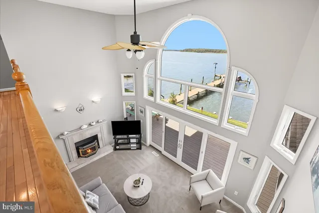 a view of a house with pool and a yard