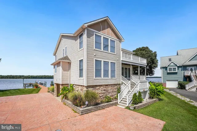 a bathroom with a shower a sink a toilet and mirror