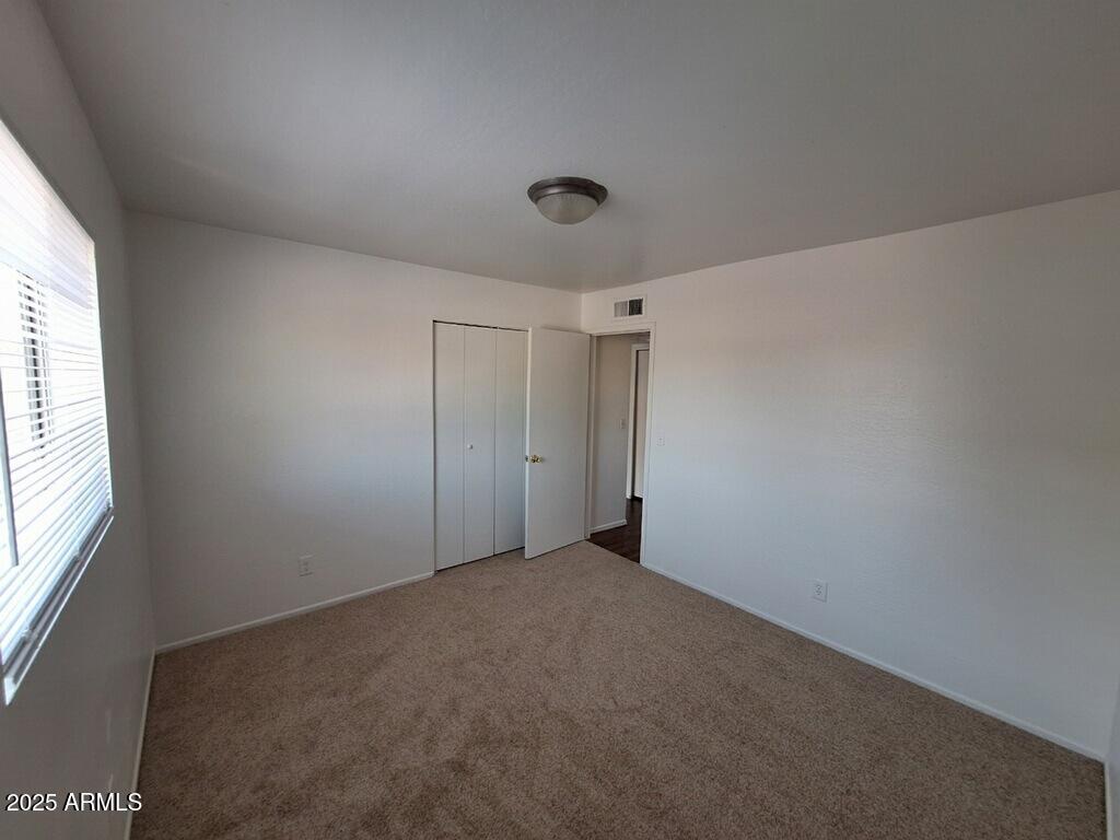 2029 North Hunt Circle, Unit 202 Mesa, AZ 85203 - Photo 7 of 9 a view of an empty room