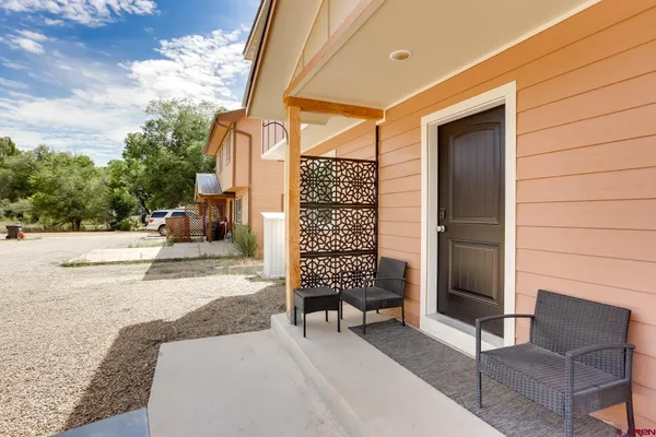 a balcony view with a outdoor seating space