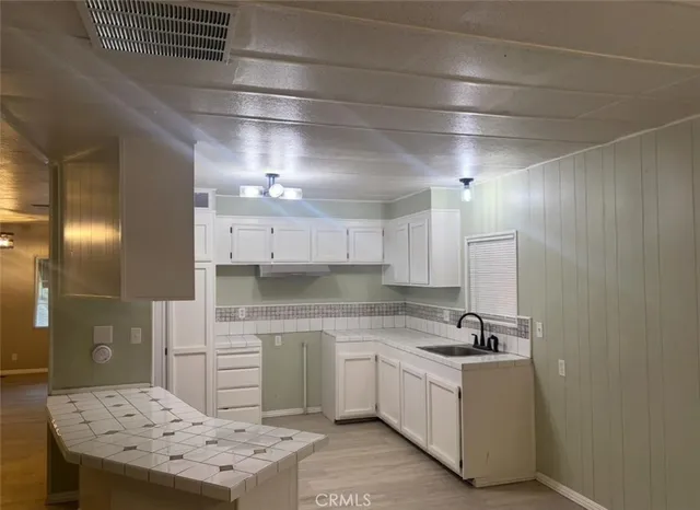 a room with furniture and chandelier