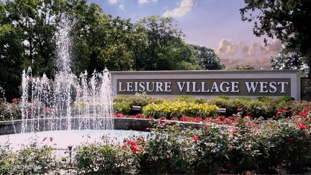 a living room with furniture a rug and a fireplace