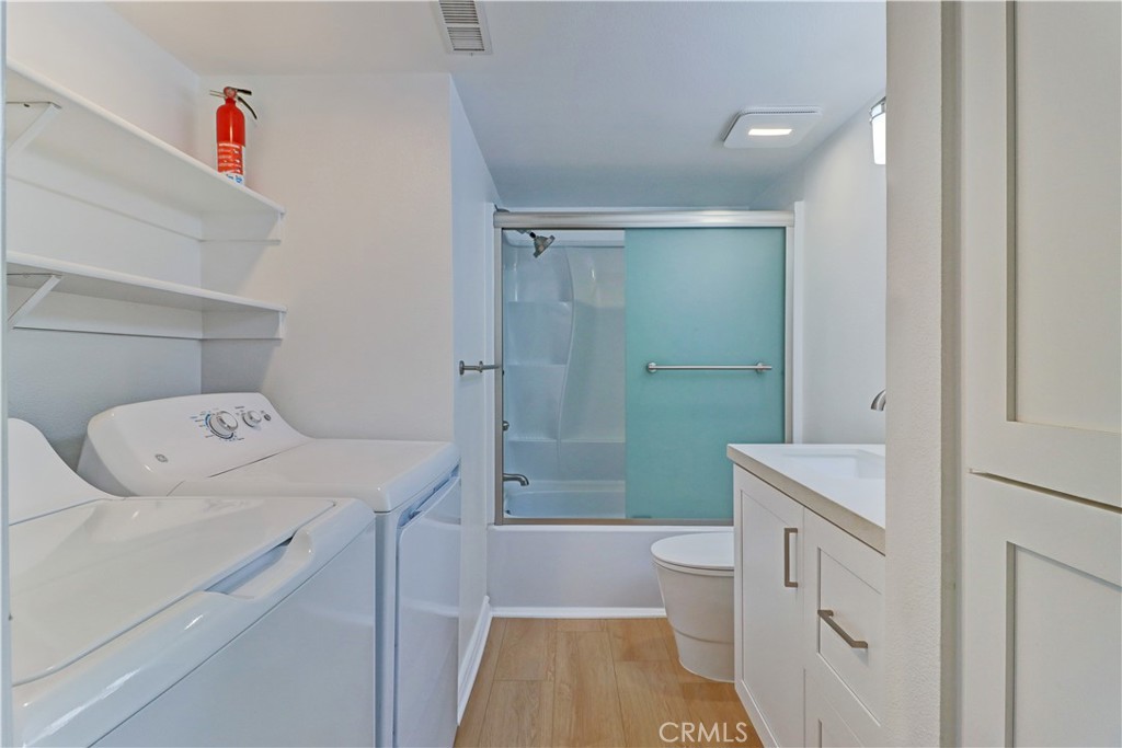 34026 Selva Road, Unit 65 Dana Point, CA 92629 - Photo 15 of 21 a bathroom with a sink a toilet and shower