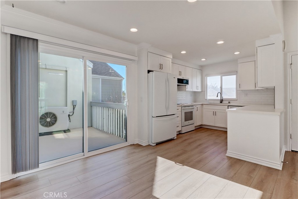 34026 Selva Road, Unit 65 Dana Point, CA 92629 - Photo 6 of 21 a view of a kitchen with wooden floor