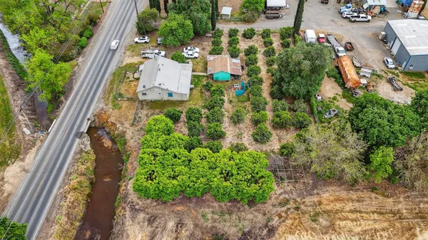 an aerial view of a house with a garden