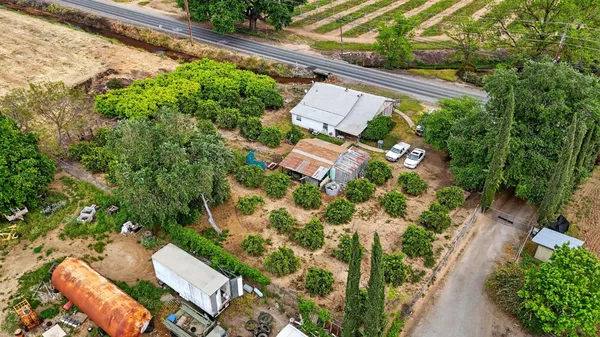 a backyard of a house with outdoor seating