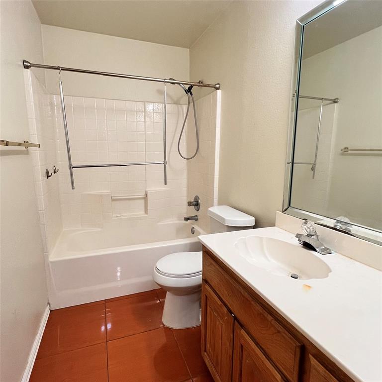 5022 El Sol Street Dallas, TX 75236 - Photo 12 of 16 a bathroom with a sink a toilet and shower