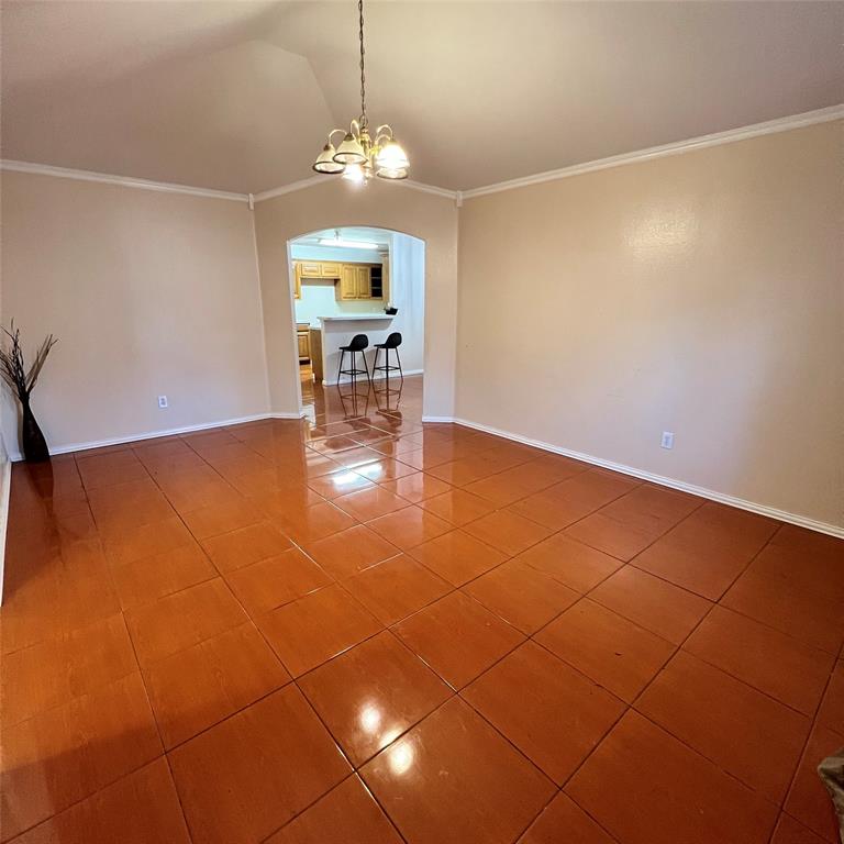 5022 El Sol Street Dallas, TX 75236 - Photo 4 of 16 a view of a dining room with furniture and chandelier