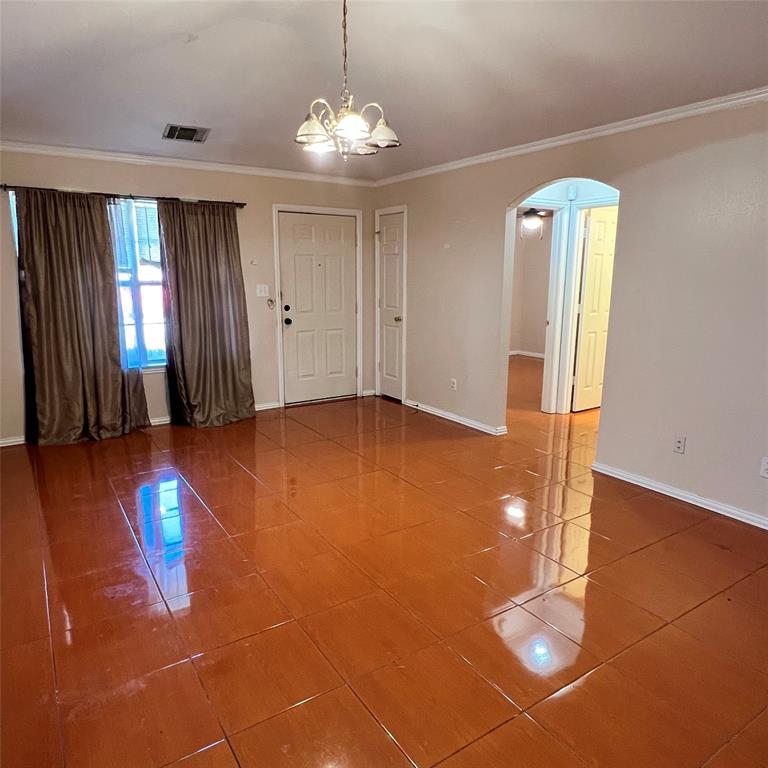 5022 El Sol Street Dallas, TX 75236 - Photo 5 of 16 a view of livingroom with hardwood floor and window
