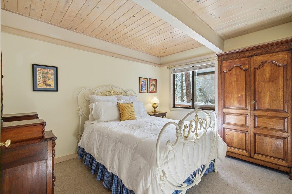 1499 Sandy Way Olympic Valley, CA 96146 - Photo 17 of 28 a bedroom with a bed and a window