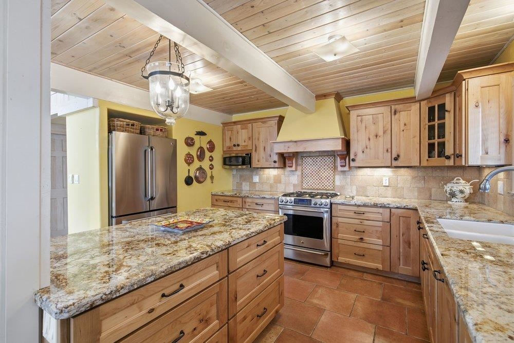 1499 Sandy Way Olympic Valley, CA 96146 - Photo 10 of 28 a kitchen with stainless steel appliances granite countertop a sink stove and refrigerator