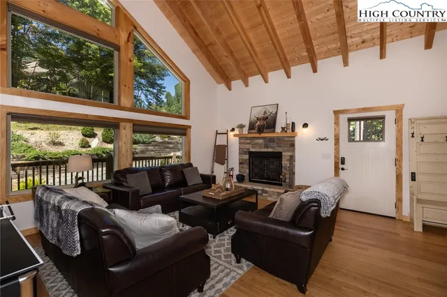 a kitchen with stainless steel appliances kitchen island granite countertop a stove a sink and a microwave