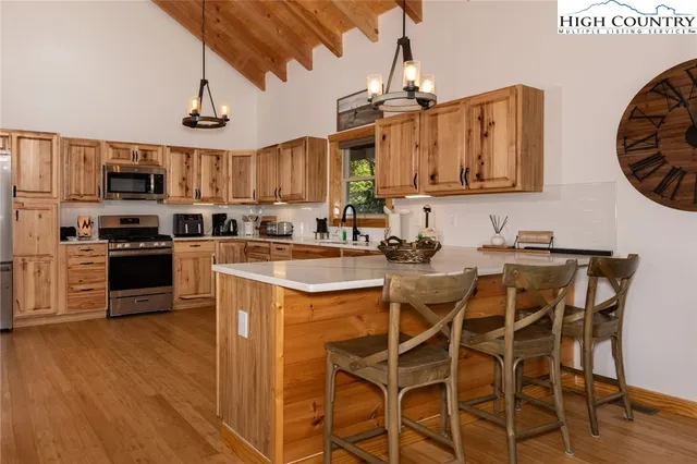 a bathroom with a double vanity sink a mirror and shower