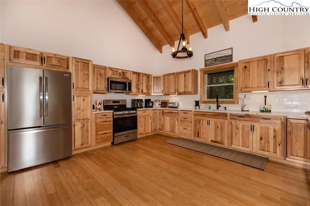 a bathroom with a shower and a sink