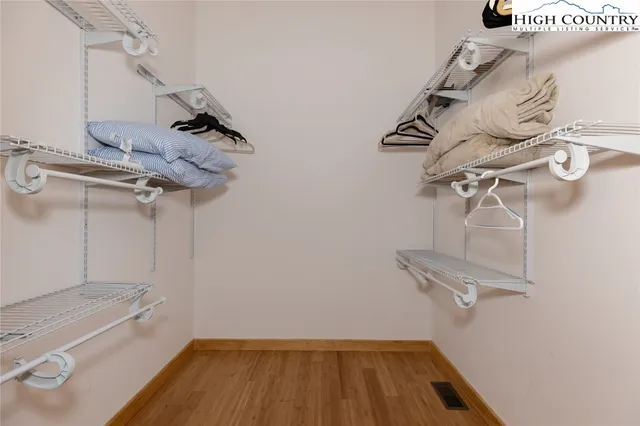 a view of a deck with table and chairs under an umbrella