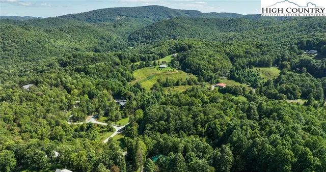 an outdoor view of house with deck and outdoor seating