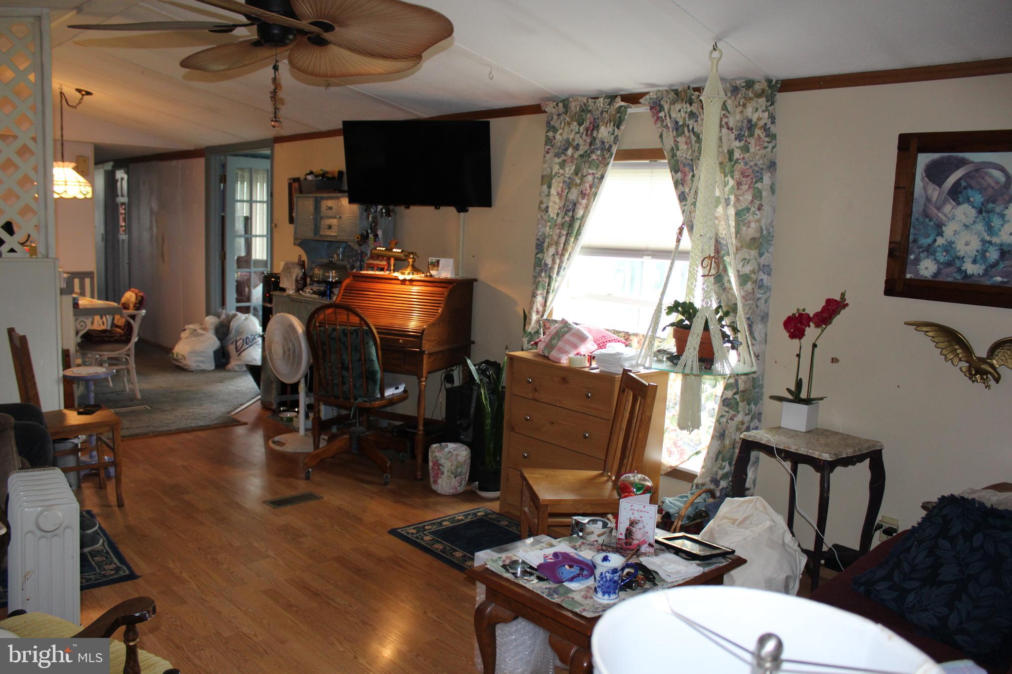 1614 Alfarata Road McClure, PA 17841 - Photo 15 of 29 a living room with furniture a window and a flat screen tv