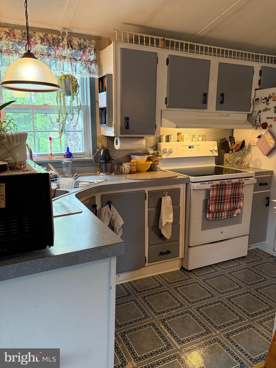 1614 Alfarata Road McClure, PA 17841 - Photo 6 of 29 a kitchen with stainless steel appliances granite countertop a sink and a stove