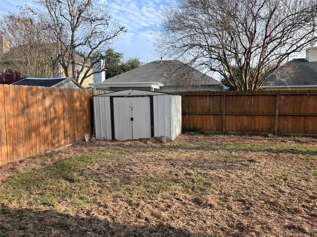 a house with a large tree in front of it