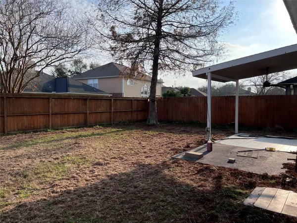 a house view with a backyard