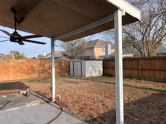 a view of a backyard of a house