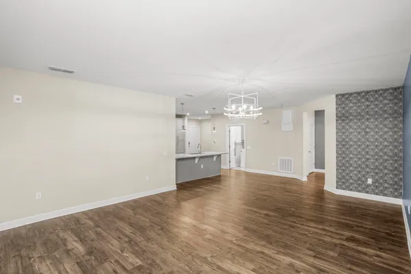 a view of a livingroom with wooden floor