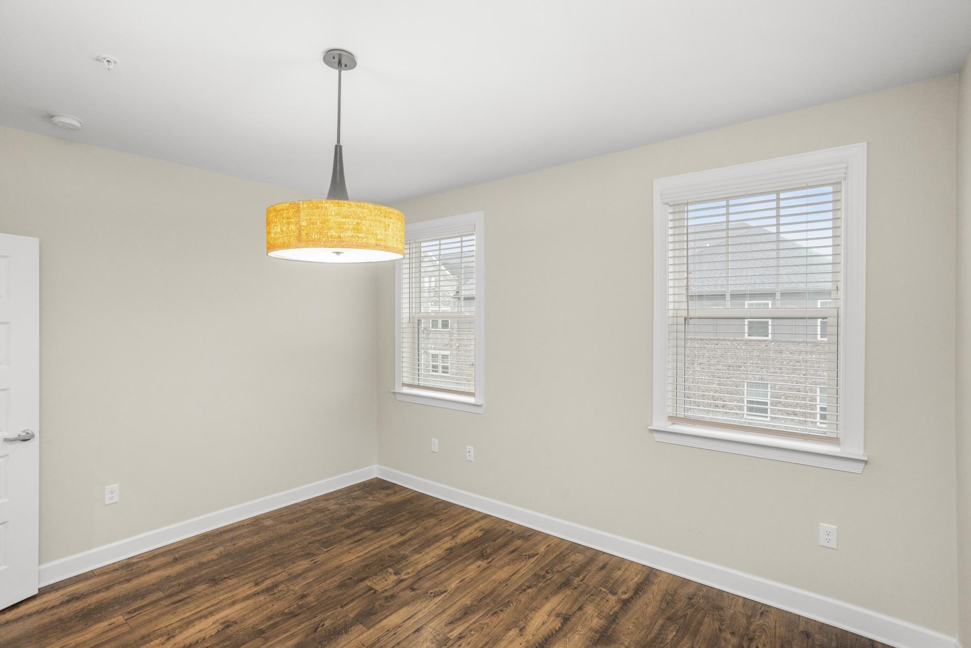 141 Saundersville Road, Unit 1402 Hendersonville, TN 37075 - Photo 28 of 60 a view of a room with wooden floor windows and a chandelier