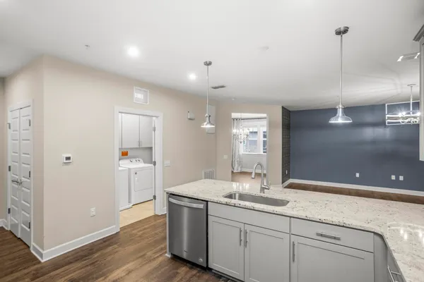 a bathroom with a double vanity sink a mirror and a shower