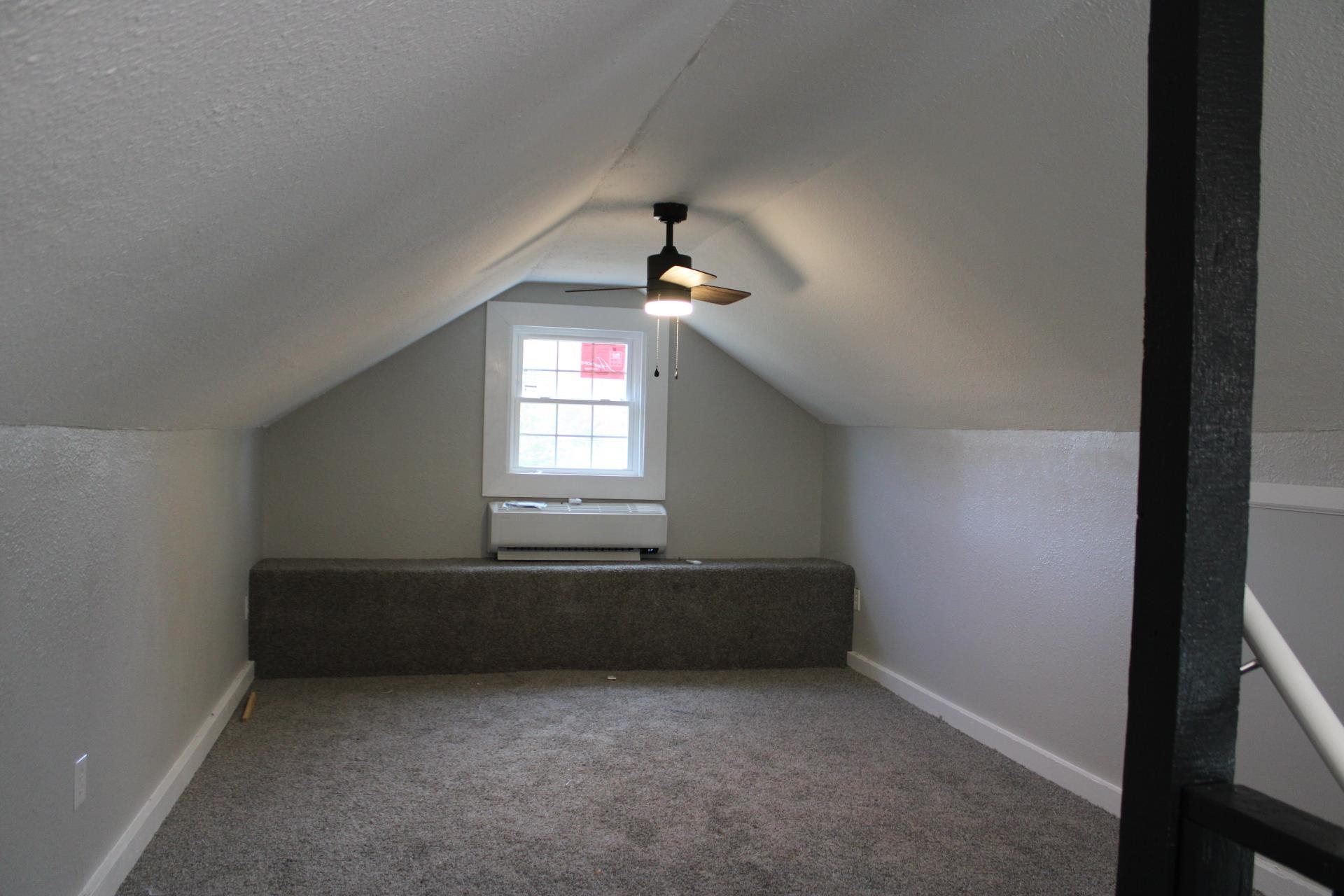 75 Curve Nankipoo Road Ripley, TN 38063 - Photo 11 of 22 an empty room with chandelier fan and windows