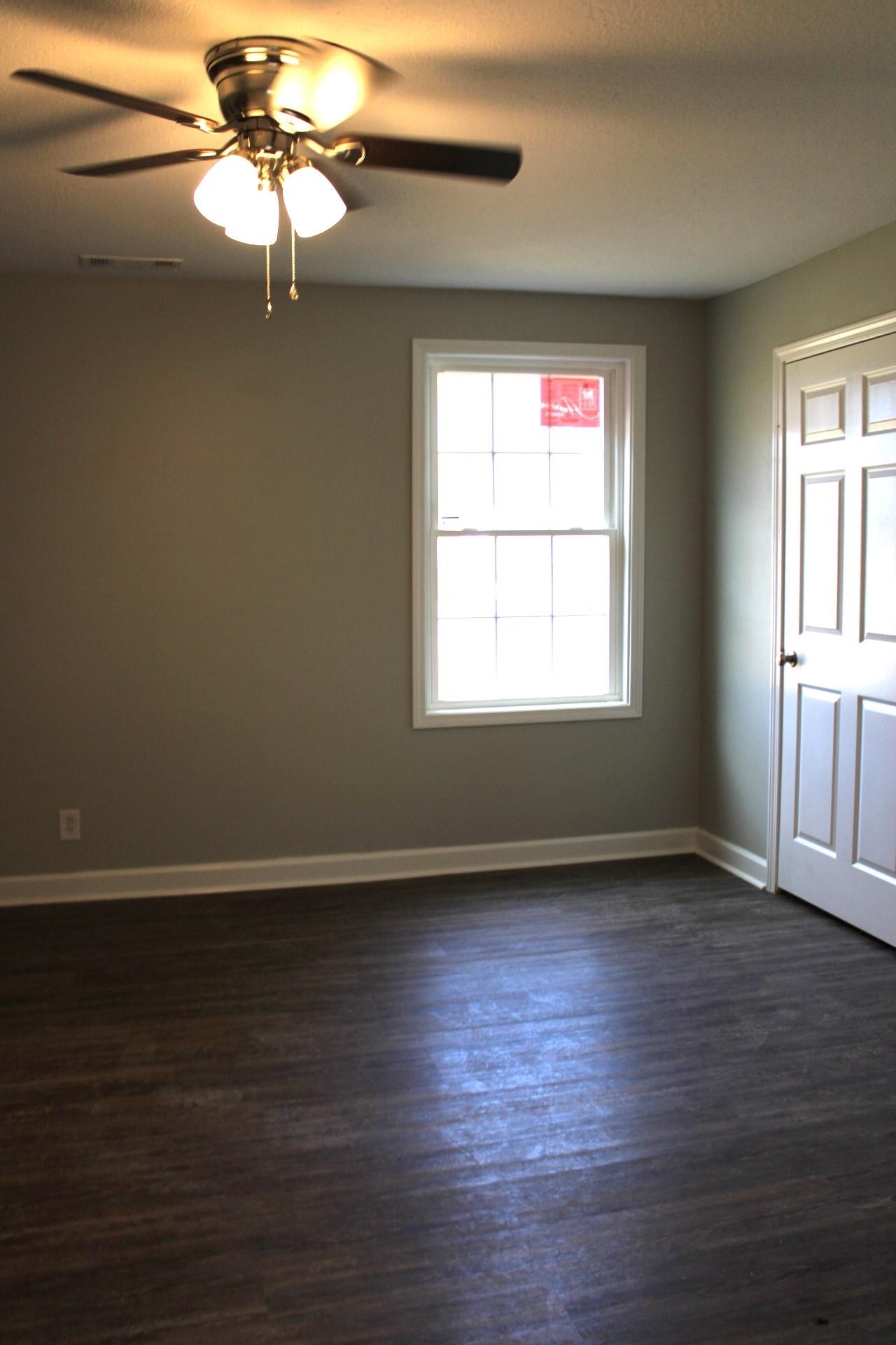 75 Curve Nankipoo Road Ripley, TN 38063 - Photo 18 of 22 a view of an empty room with wooden floor and window