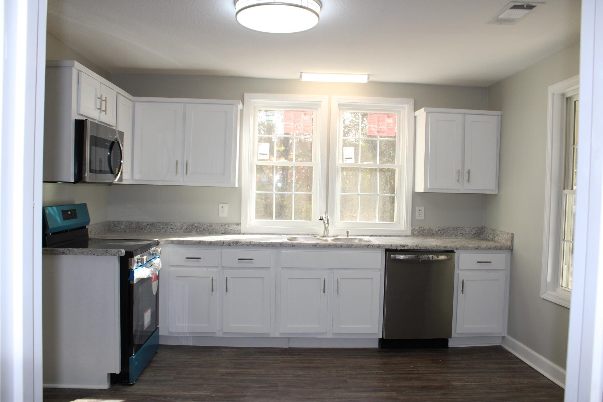 75 Curve Nankipoo Road Ripley, TN 38063 - Photo 4 of 22 a kitchen with stainless steel appliances granite countertop a stove a sink and a microwave