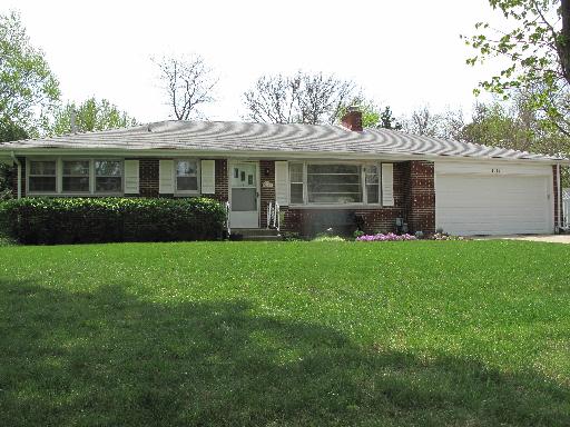 2144 Pleasure View Road Aurora, IL 60506 - Photo 1 of 1 a front view of a house with a garden and plants