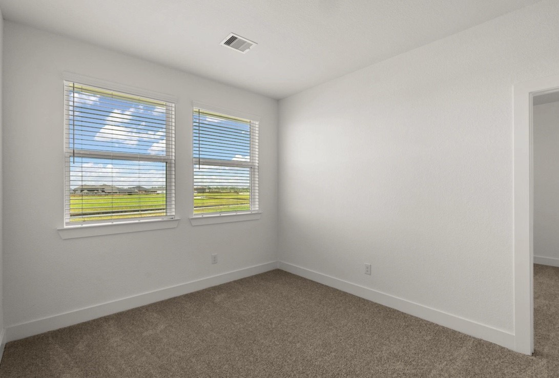 5234 Capricorn Way Manvel, TX 77578 - Photo 11 of 25 an empty room with a window