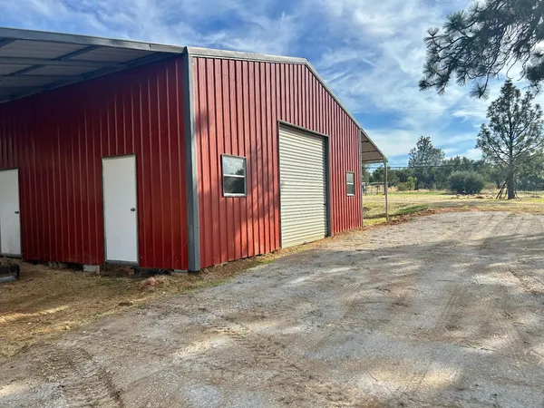 a view of a backyard of the house