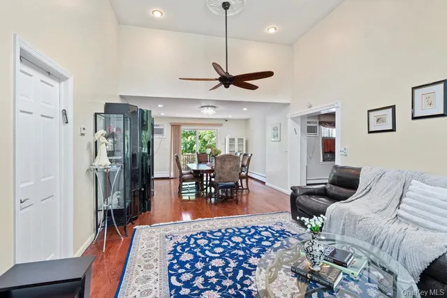 a living room with furniture a window and a table
