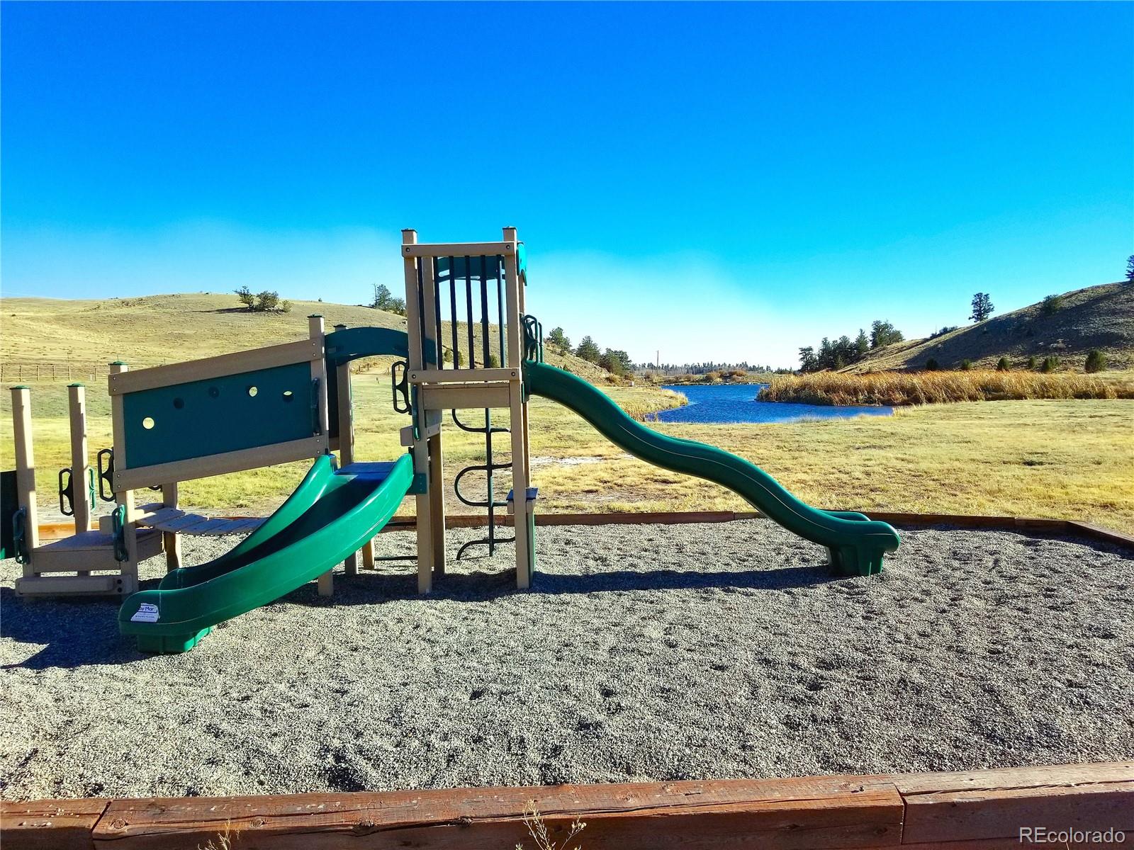 893 Rocky Mountain Road Hartsel, CO 80449 - Photo 24 of 31 a view of a swimming pool with a yard