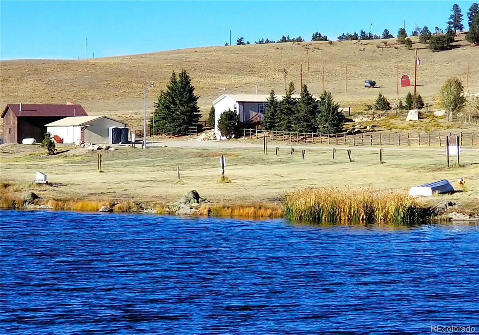 893 Rocky Mountain Road Hartsel, CO 80449 - Photo 25 of 31 a view of a swimming pool and an ocean view