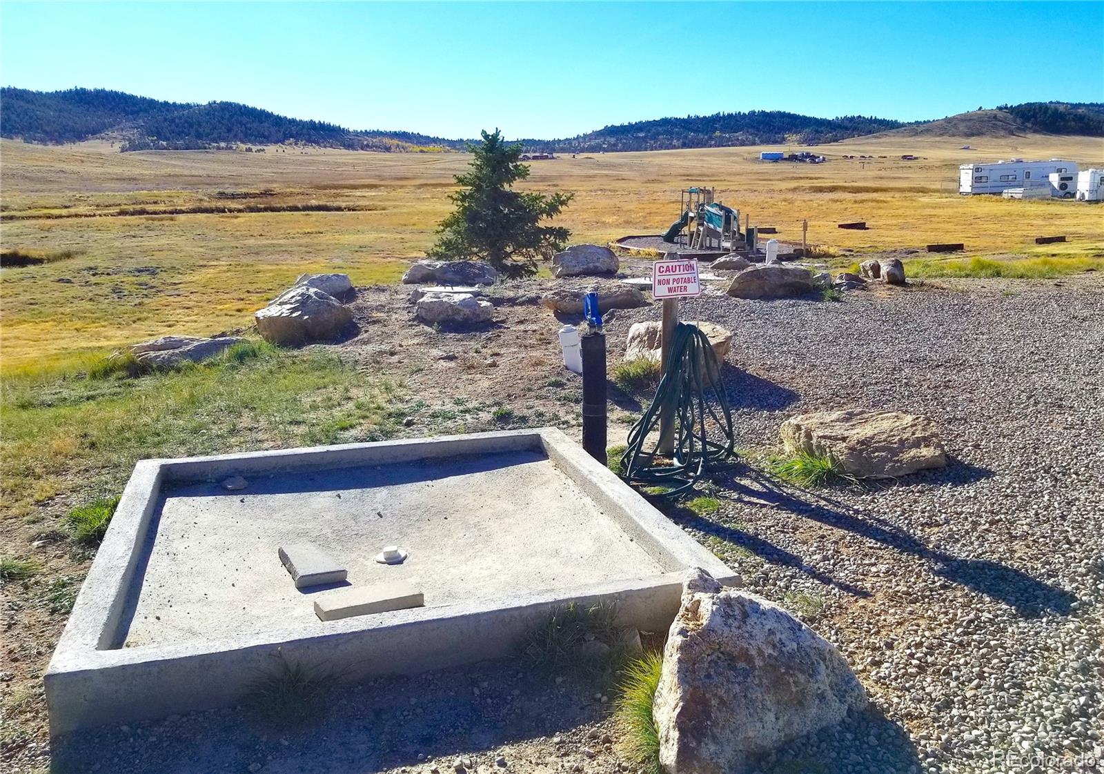 893 Rocky Mountain Road Hartsel, CO 80449 - Photo 26 of 31 a view of a lake with a mountain