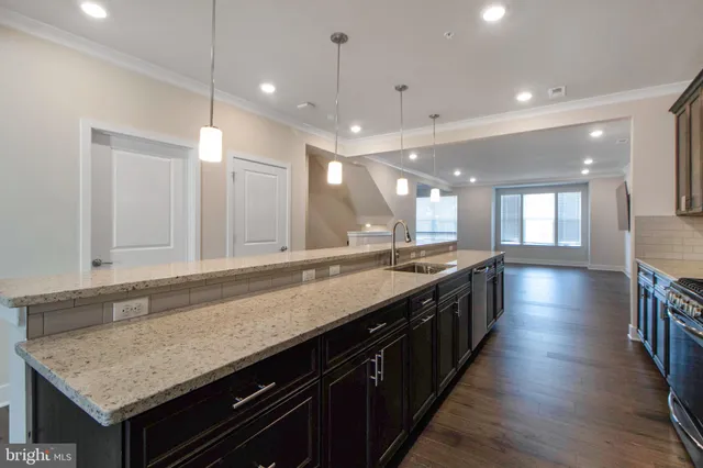 an empty room with closet and a bathroom