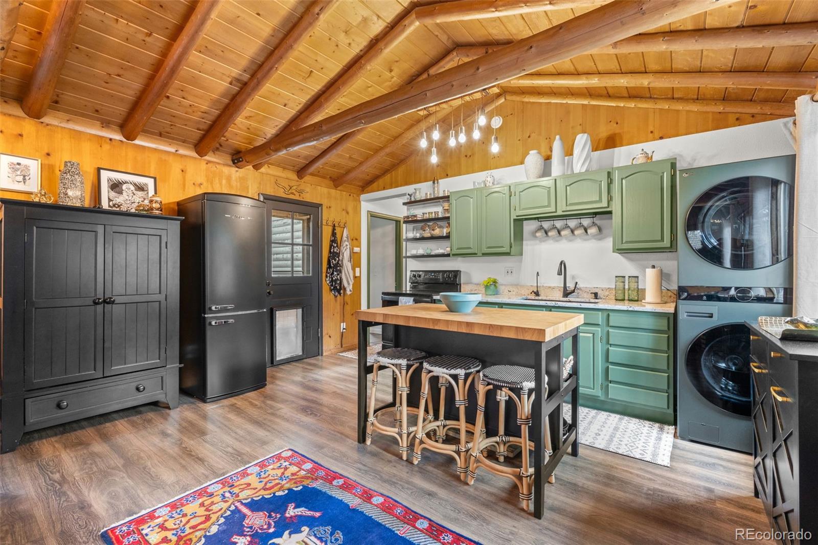 12159 Circle Drive Conifer, CO 80433 - Photo 14 of 49 a view of a kitchen with refrigerator and wooden floor